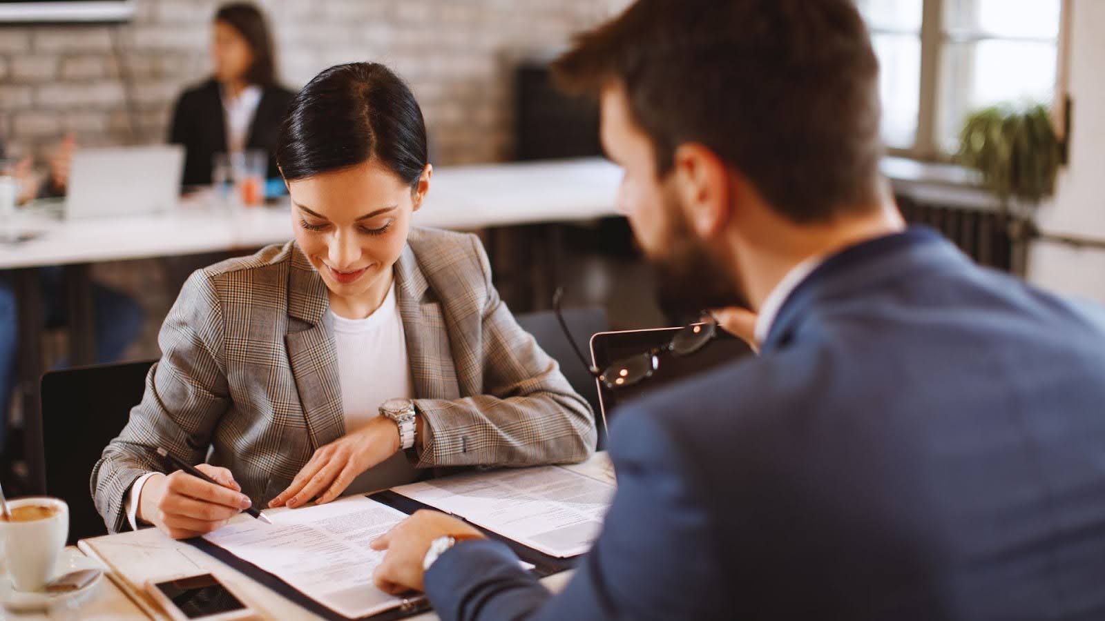 business attorneys reviewing documents 